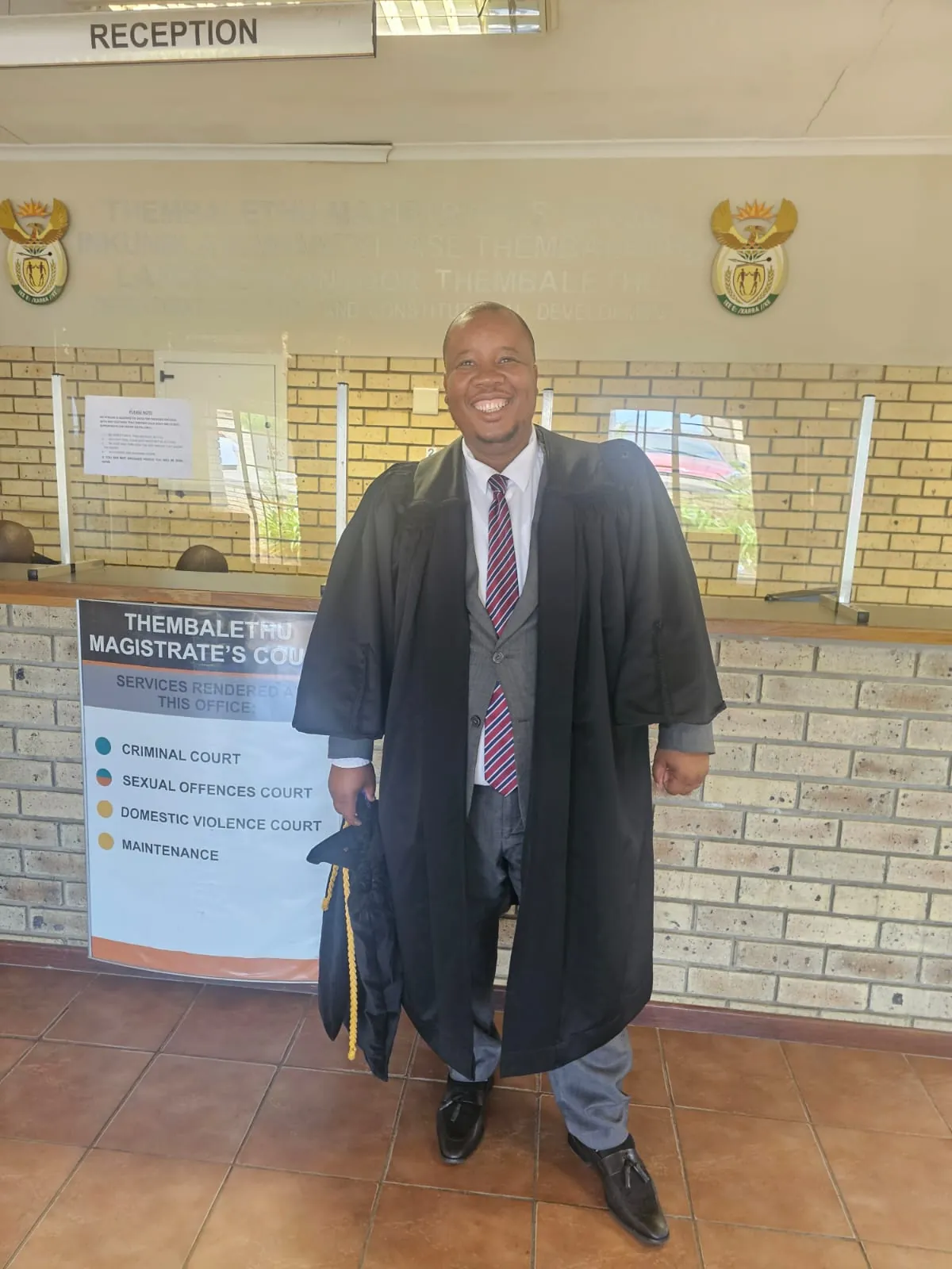 Washington Magampa in his robes at a magistrate's court reception